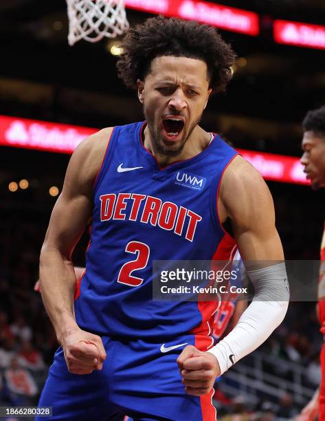 Cade Cunningham of the Detroit Pistons reacts as he draws a foul after dunking against Trae Young of the Atlanta Hawks during the fourth quarter at...