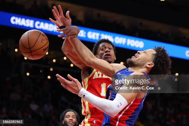 De'Andre Hunter of the Atlanta Hawks blocks a shot attempt against Cade Cunningham of the Detroit Pistons during the fourth quarter at State Farm...