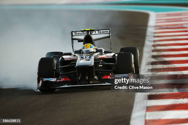 Esteban Gutierrez of Mexico and Sauber F1 locks his brakes while driving during qualifying for the Abu Dhabi Formula One Grand Prix at the Yas Marina...