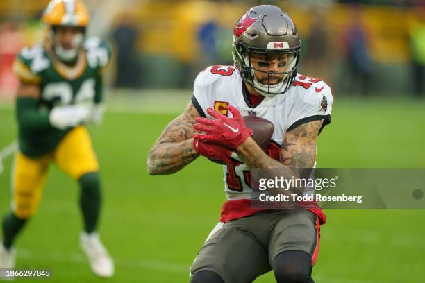 Wide Receiver Mike Evans of the Tampa Bay Buccaneers catches the ball during an NFL football game against the Green Bay Packers at Lambeau Field on...