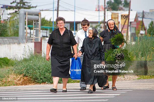 Group of locals on their way to the cemetery "Cimitirul Pomenirea" in the Romanian city of Arad.
