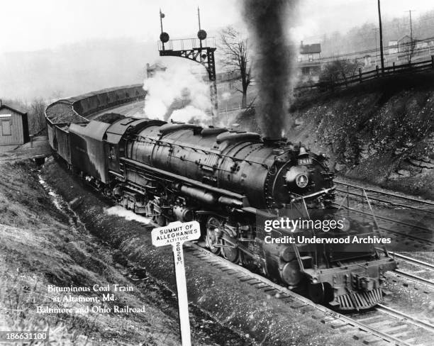 Baltimore and Ohio bituminous coal train crossing the summit of the Allegheny Mountains at 2628 feet, Altamont, Maryland, mid to late 1920s.