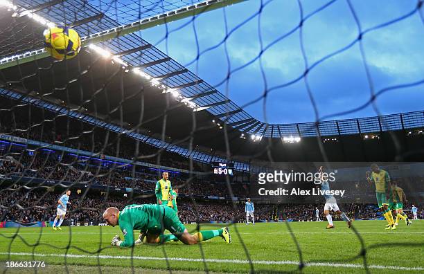 Sergio Aguero of Manchester City celebrates the sixth goal during the Barclays Premier League match between Manchester City and Norwich City at...