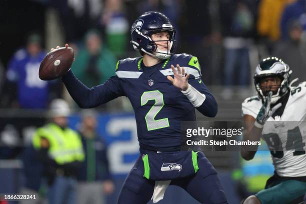 Drew Lock of the Seattle Seahawks looks to pass in the second half at Lumen Field on December 18, 2023 in Seattle, Washington.