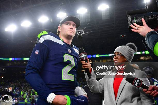 Drew Lock of the Seattle Seahawks speaks to Lisa Salters at Lumen Field on December 18, 2023 in Seattle, Washington.