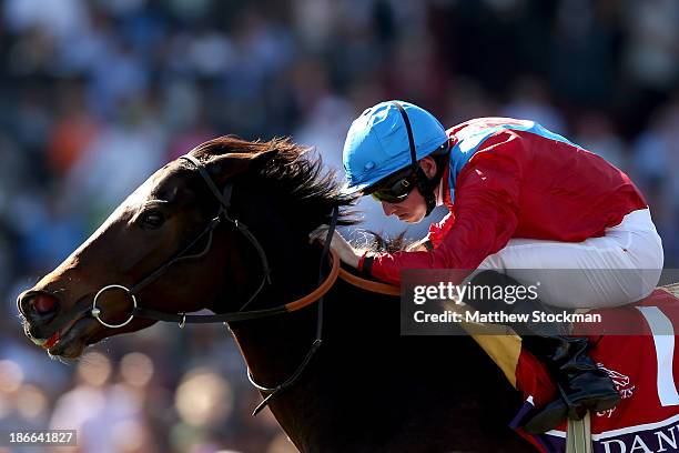 Dank, riden by Ryan Moore, surges to the finish line to win the Filly & Mare Turf during the 2013 Breeders' Cup World Championships at Santa Anita...