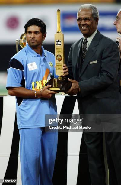 Sachin Tendulkar of India is presented the Man of the Series trophy by Sir Garfield Sobers after the ICC Cricket World Cup Final between India and...