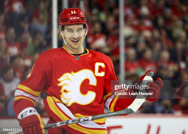 Mikael Backlund of the Calgary Flames skates during a break in play against the Florida Panthers in the third period at the Scotiabank Saddledome on...