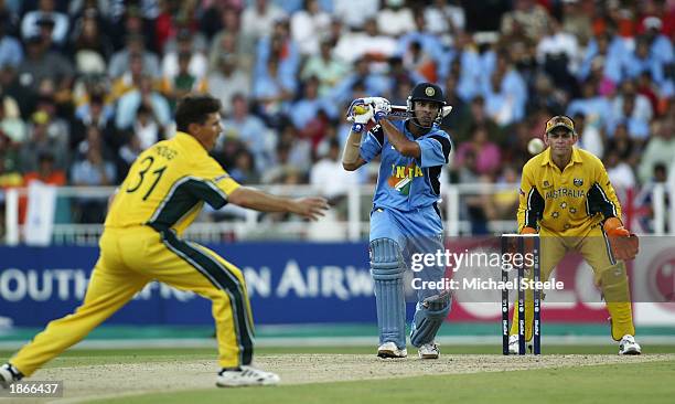 Yuvraj Singh of India hits out at the bowling of Brad Hogg of Australia during the ICC Cricket World Cup Final between India and Australia at The...