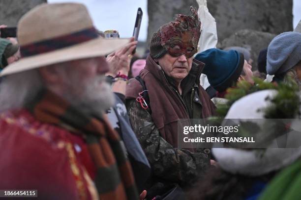 Revellers celebrate the pagan festival of 'Winter Solstice' at Stonehenge in Wiltshire in southern England on December 22, 2023. Followers of...