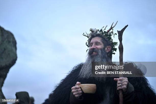 The "King of the Pixies" joins revellers celebrating the pagan festival of 'Winter Solstice' at Stonehenge in Wiltshire in southern England on...