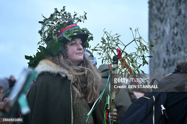 People take viewing positions waiting for the sunrise as revellers celebrate the pagan festival of 'Winter Solstice' at Stonehenge in Wiltshire in...