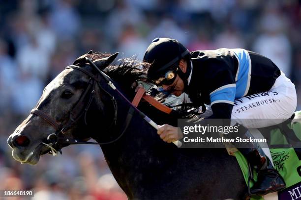 Mizdirection, riden by Mike Smith, surges to the finish line to win the Turf Sprint during the 2013 Breeders' Cup World Championships at Santa Anita...