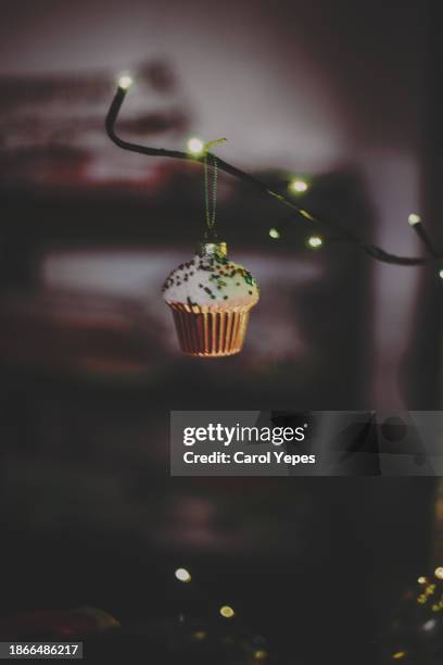 cupcake christmas baubles on the xmas tree - cypress tree illustration stock pictures, royalty-free photos & images