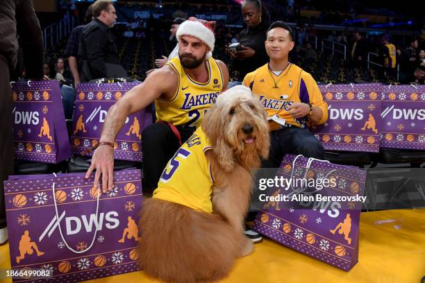 Brodie The Goldendoodle attends a basketball game between the Los Angeles Lakers and the New York Knicks at Crypto.com Arena on December 18, 2023 in...