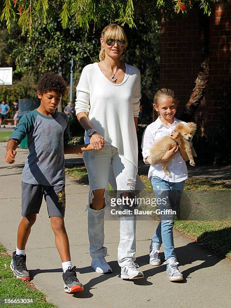 Heidi Klum and her children, son Henry Samuel and daughter, Leni Samuel are seen on November 02, 2013 in Los Angeles, California.