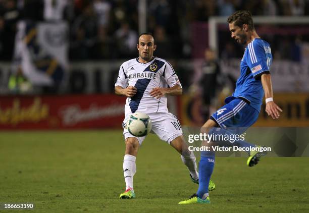 Landon Donovan of the Los Angeles Galaxy and Clarence Goodson of the San Jose Earthquakes vie for the ball in the second half of their MLS match at...