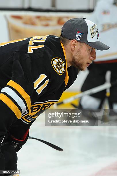 Gregory Campbell of the Boston Bruins wears a 2013 Red Sox World Seres Championship hat during warm ups prior to the game against the Anaheim Ducks...