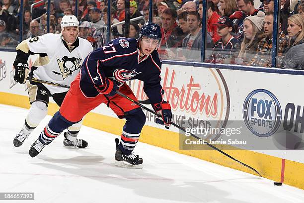 Ryan Murray of the Columbus Blue Jackets looks up ice as he skates towards the puck during the second period on November 2, 2013 at Nationwide Arena...