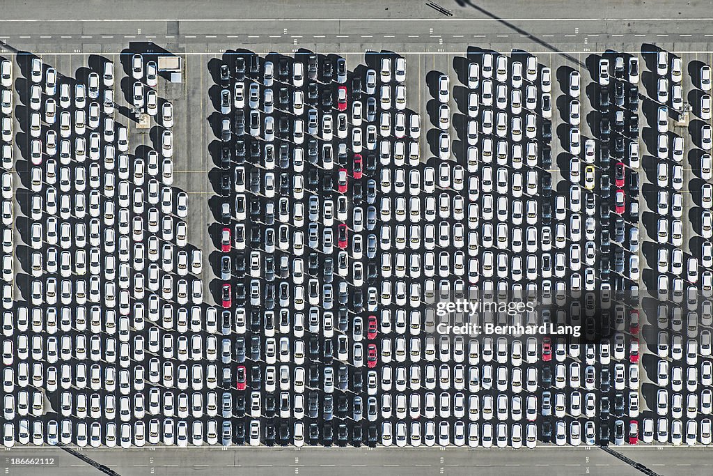 Aerial view of new cars on parking ground