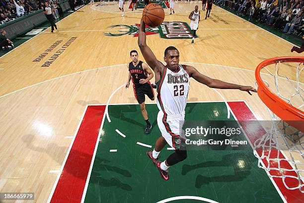 Khris Middleton of the Milwaukee Bucks dunks against the Toronto Raptors on November 2, 2013 at the BMO Harris Bradley Center in Milwaukee,...