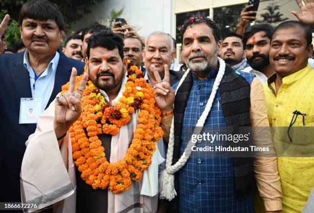 Sanjay Singh with Brij Bhushan Sharan Singh at his residence after winning the WFI president Elections on December 21, 2023 in New Delhi, India.
