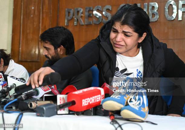 Wrestlers Vinesh Phogat , Bajrang Punia and Sakshi Malik during a press conference at Press Club of India on December 21, 2023 in New Delhi, India....