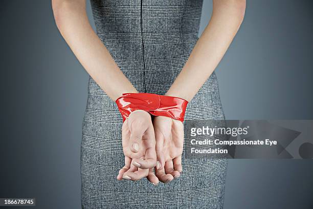 Woman Hands Tied Behind Back Photos And Premium High Res Pictures 