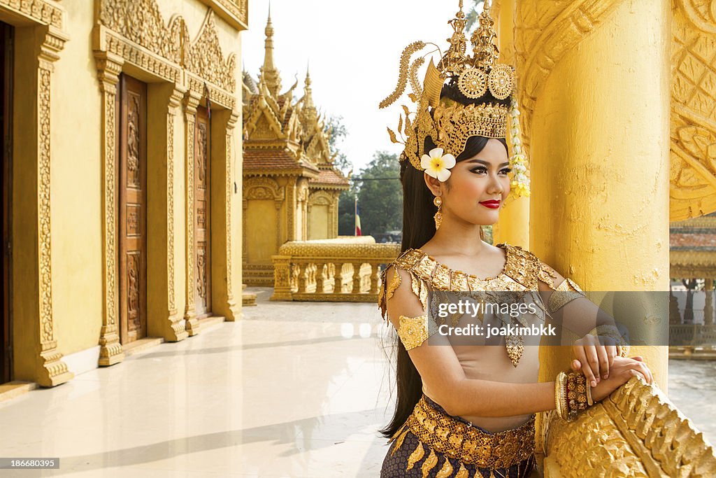 Asian Apsara woman dancer overlooking the temple