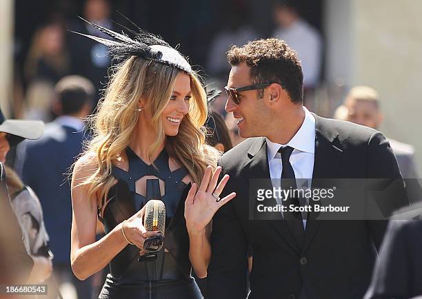 Jennifer Hawkins and Jake Wall arrive at the Myer marquee on Victoria Derby Day at Flemington Racecourse on November 2, 2013 in Melbourne, Australia.