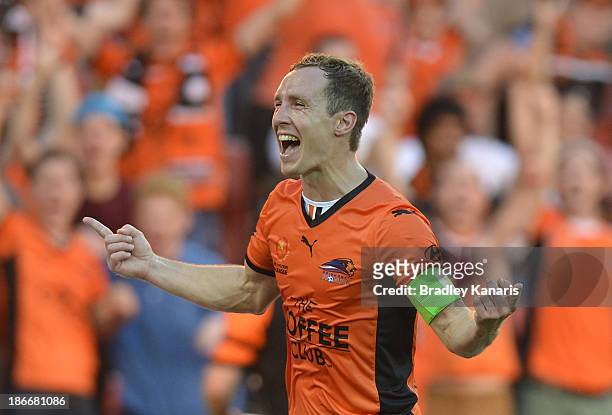 Matthew Smith of the Roar celebrates after scoring a goal during the round four A-League match between Brisbane Roar and the Melbourne Heart at...