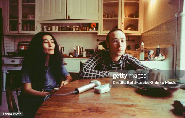 Artist Yoko Ono is interviewed by journalist Nobuyuki Yoshinari , with singer and musician John Lennon by her side, at their apartment in The Dakota...