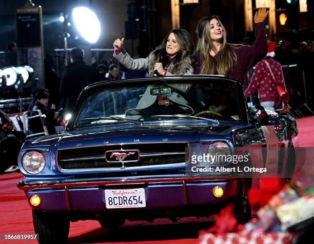 Alanna Ubach and Giorgia Whigham ride inattends the 91st Hollywood Christmas Parade held on November 26, 2023 in Hollywood, California.