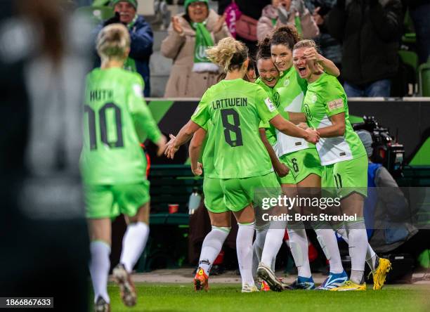 Dominique Janssen of VfL Wolfsburg celebrates with teammates after scoring his team's first goal during a Google Pixel Frauen-Bundesliga match...