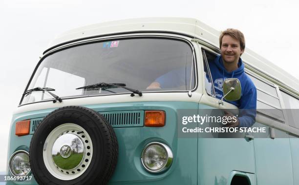 Volkswagen Kombi owner Wanja Fuhrmann poses inside his Volkswagen T2 camper van built in the year 1975 near Landsberg, southern Germany, on November...