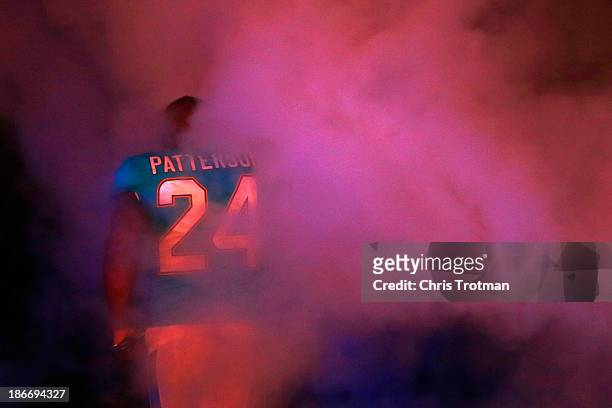Dimitri Patterson of the Miami Dolphins enters the field prior to the game against the Cincinnati Bengals at Sun Life Stadium on October 31, 2013 in...