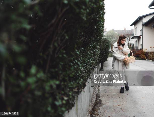 woman arriving home with the groceries for season holidays, using sustainable way of shopping bag, basket. no plastic bags. - backless dress stock pictures, royalty-free photos & images