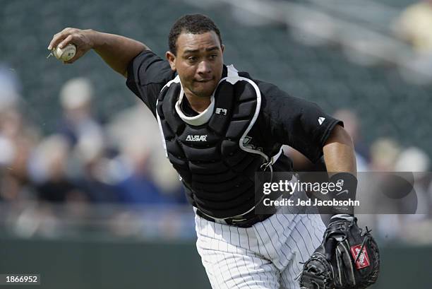 Miguel Olivo of the Chicago White Sox throws to first against the San Francisco Giants in a Spring Training game on March 3, 2003 at Electric Park in...