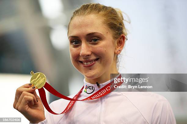 Gold medal winner Laura Trott of Great Britain celebrates on the podium after the Women's Omnium on day three of the UCI Track Cycling World Cup at...