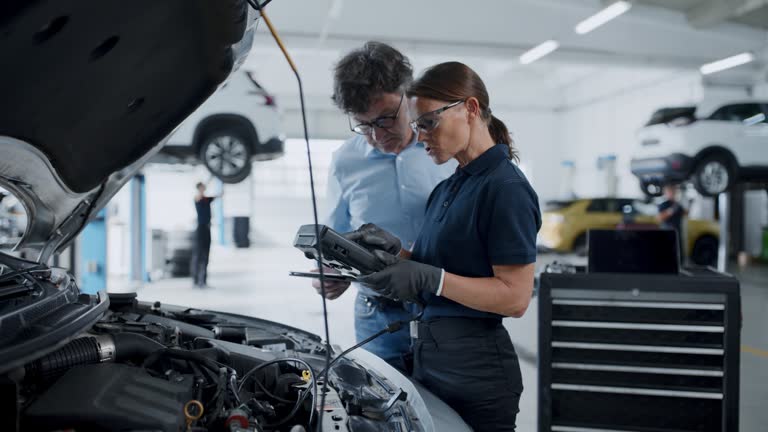 https://media.gettyimages.com/id/1867028202/video/female-mechanic-running-diagnostic-test-on-car-engine-in-repair-shop-manager-checks-data-on-a.jpg?b=1&s=640x640&k=20&c=tuEM5aBgjZ4eqNfrm0_2V8VodqqlKjTG9dbVV5VCytE=