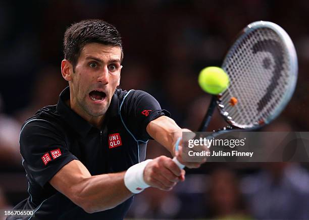 Novak Djokovic of Serbia in action against David Ferrer of Spain in the final during day seven of the BNP Paribas Masters at Palais Omnisports de...