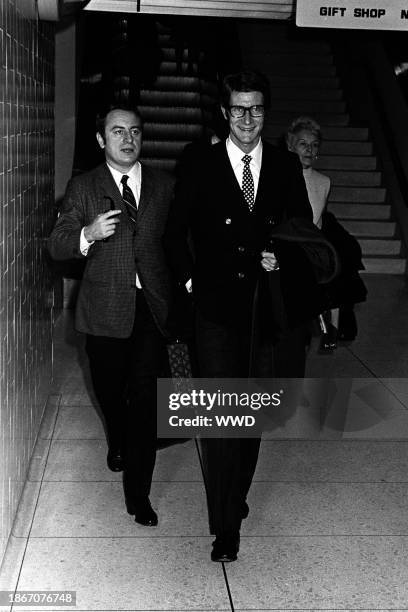 Pierre Berge and Yves Saint Laurent arrive in Los Angeles, California in October 1965