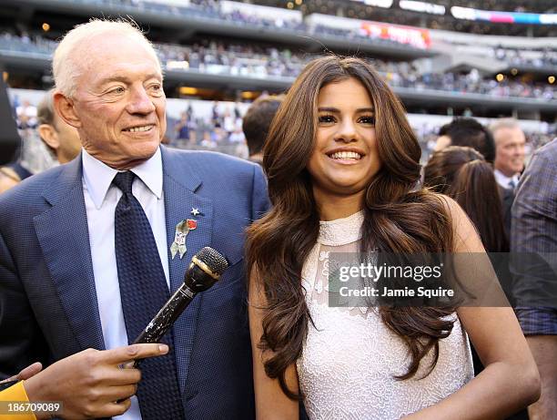 Singer and actress Selena Gomez talks with Dallas Cowboys team owner Jerry Jones after announcing she will be the halftime entertainment on...