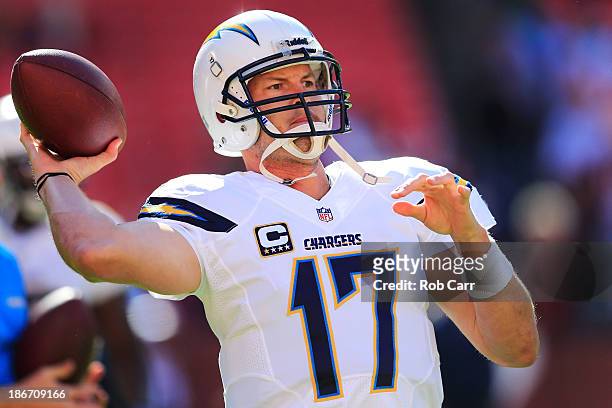 Quarterback Philip Rivers of the San Diego Chargers throws a pass while warming up before the start of the Chargers game against the Washington...