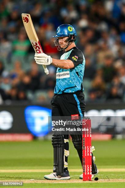 Arcy Short of the Strikers celebrates making his half century during the BBL match between Adelaide Strikers and Sydney Thunder at Adelaide Oval, on...