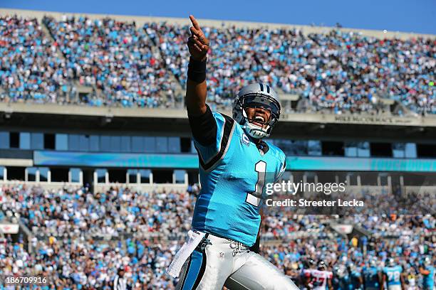 Cam Newton of the Carolina Panthers celebrates after his team scores a touchdown against the Atlanta Falcons during their game at Bank of America...