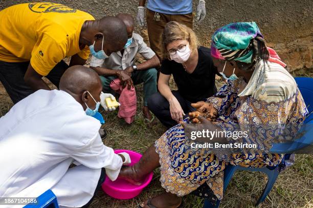 Drugs for Neglected Disease biologist Dr Sabine Specht works with her Congolese colleagues to examine people for symptoms of river blindness. She is...