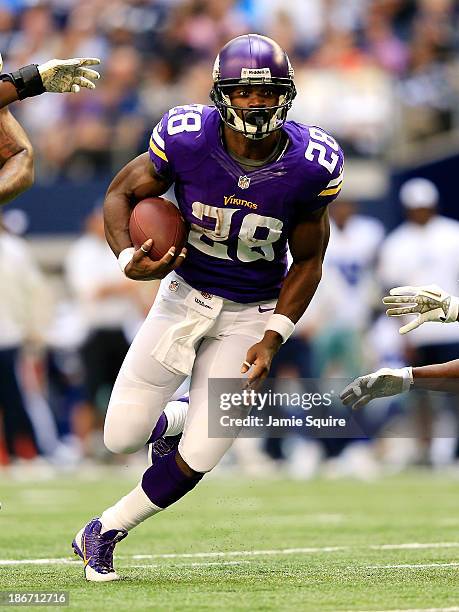 Running back Adrian Peterson of the Minnesota Vikings carries the ball during the game against the Dallas Cowboys at Cowboys Stadium on November 3,...