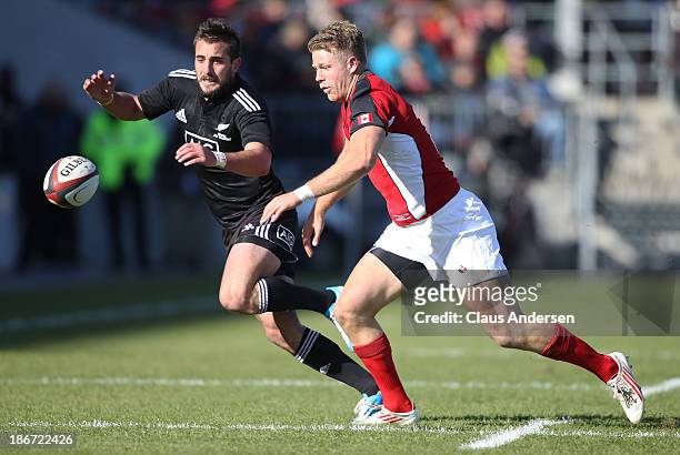 Andre Taylor of the New Zealand Maori All Blacks plays against Harry Jones of Team Canada during the AIG Canada friendly game at BMO Field on...