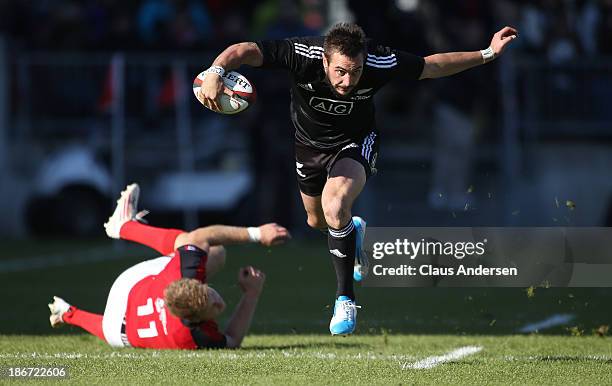 Andre Taylor of the New Zealand Maori All Blacks breaks a tackle against Team Canada during the AIG Canada friendly game at BMO Field on November 3,...